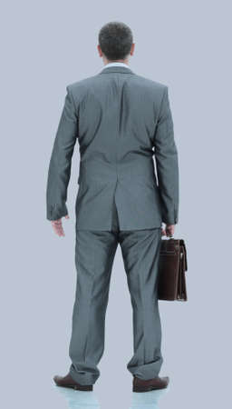 Happy mature man in suit smiling while standingの写真素材