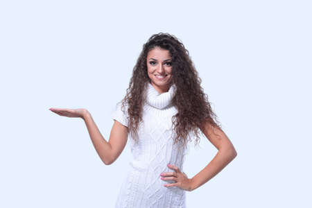 Smiling woman pointing finger at copy space.の写真素材