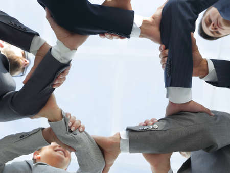 business team are taking each others handsの写真素材