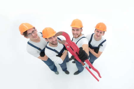 view from the top.the team of plumbers showing gas keysの写真素材