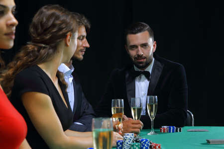 brunette girl in the casino playing pokerの写真素材