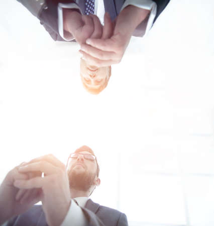 View from below. From behind the glass. Two businessmen sitting at the table.の写真素材