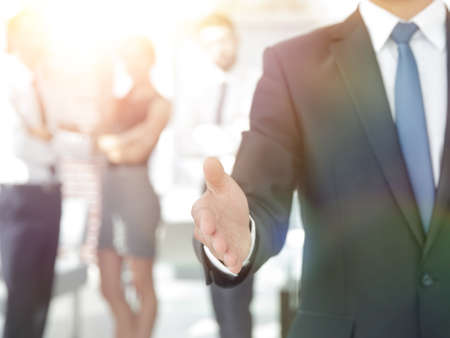 successful businessman giving a handの写真素材