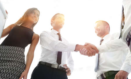 handshake business colleagues after discussing the new presentation.
