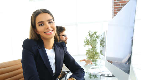 young employee sitting at a Desk