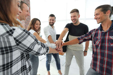 business team with hands clasped together