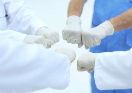 Doctors and nurses coordinate hands.の写真素材