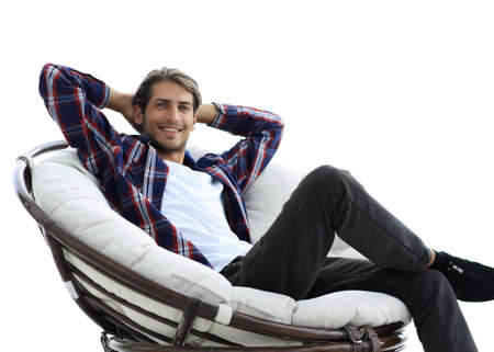 close-up. a successful guy sitting in a large round comfortable chair