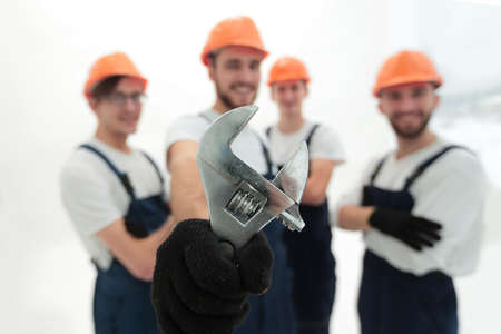 closeup. the wrench in the hands of the buildersの写真素材