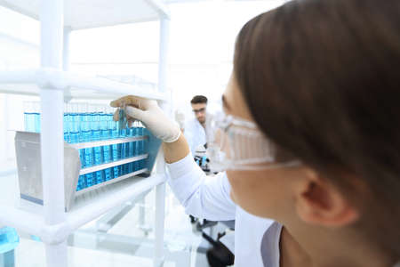 Young woman with test tubes in the laboratoryの写真素材