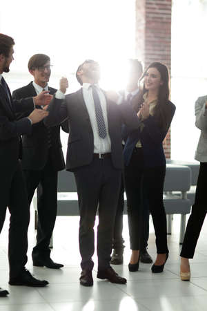 Businessmen are congratulating their successful sales.の写真素材