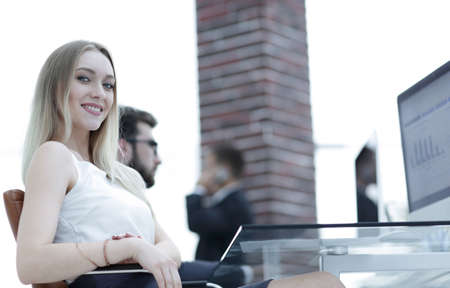 young business woman sitting at a desk in the office .の写真素材