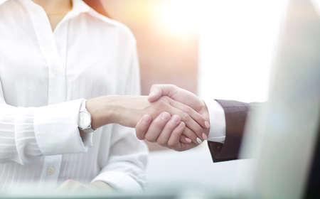 close-up of handshake businessman and business woman.の写真素材