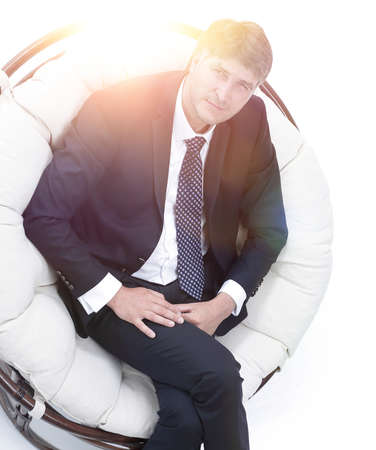 Top view of successful businessman sitting in comfortable chairの写真素材