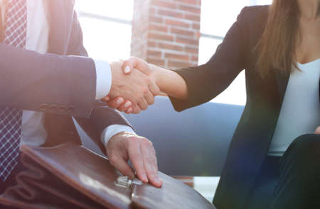 Businessman shaking hands to seal a deal with his partnerの写真素材