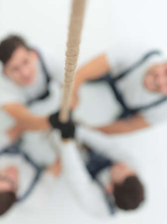 background image is a group of workers rising upの写真素材