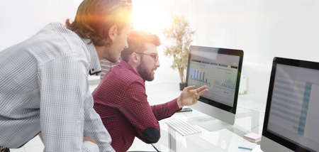 colleagues discussing financial dataの写真素材