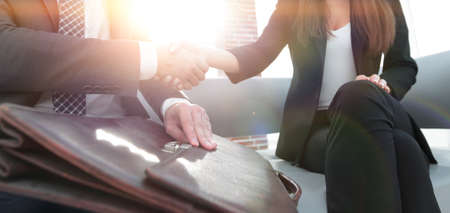 Businessman shaking hands to seal a deal with his partnerの写真素材