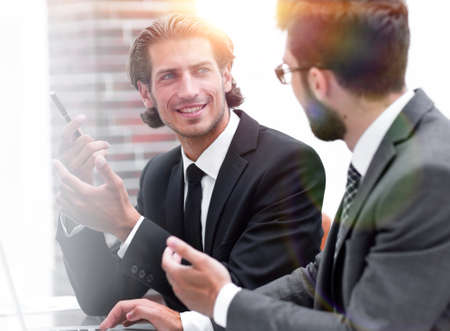 two clerks sitting at their Desk.の写真素材