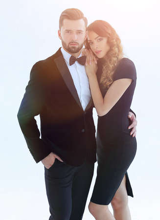 portrait of an elegant woman in a black dress hugging her loverの写真素材