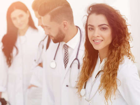 portrait of female doctors with colleaguesの写真素材