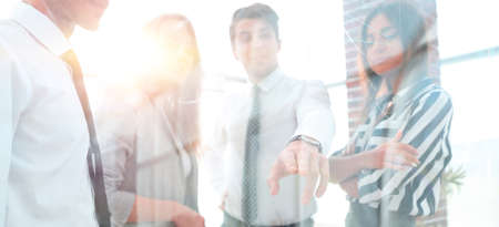 from behind the glass.business team in the officceの写真素材