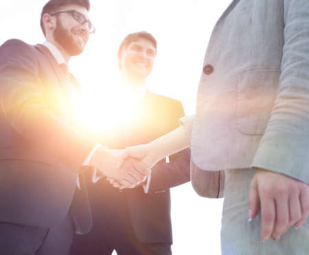 Close-up of business people shaking hands