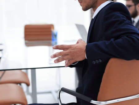 closeup.businessman sitting at his Desk
