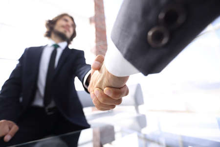 Close-up of two business people shaking hands