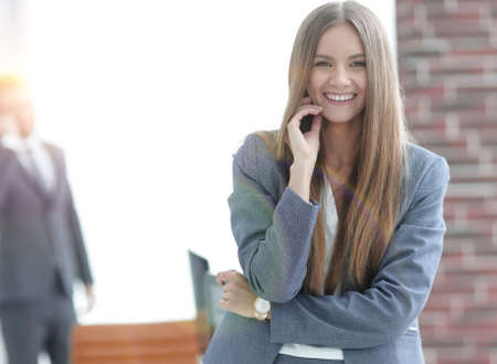 successful business woman on blurred background officeの写真素材
