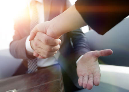 Businessman shaking hands to seal a deal with his partnerの写真素材