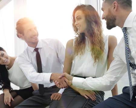 welcome handshake between two colleagues.の写真素材