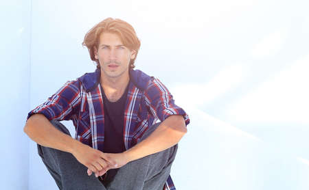 modern young man thinks.isolated on white.の写真素材