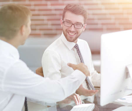 handshake of the employees at the Deskの写真素材