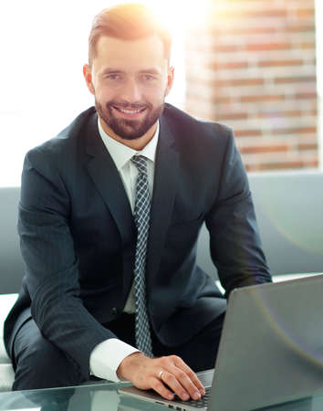 Businessman working with documents sitting on couch.の写真素材