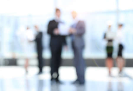 business background.blurred image of business people standing inの写真素材
