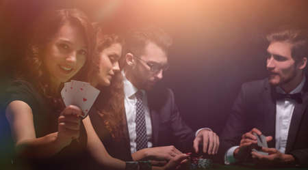 smiling woman with the winning combination of cardsの写真素材