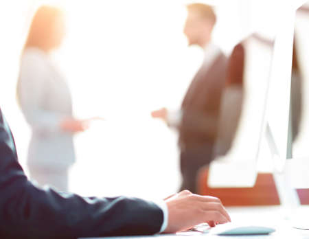employee is typing on the computer keyboard.の写真素材