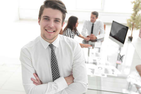 successful businessman on background of office.