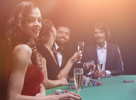 brunette girl in the casino playing pokerの写真素材