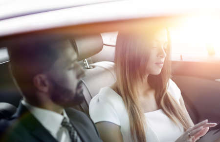 Two Business People Working In Car Backの写真素材