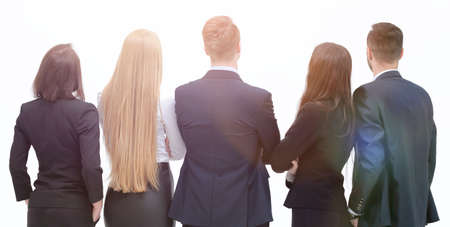 rear view. business team looking at a white screenの写真素材