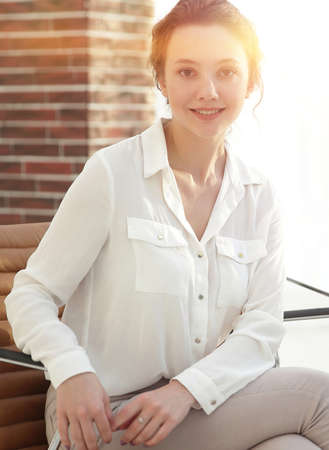 successful young business woman sitting at the desk.