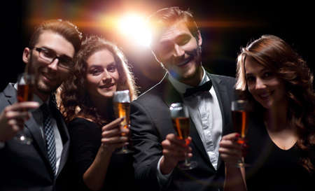 portrait of a group of friends celebrating their success