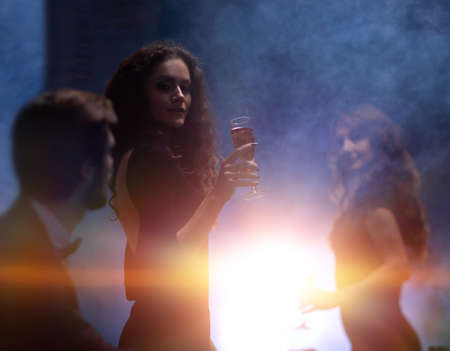 two glamorous woman in a casinoの写真素材