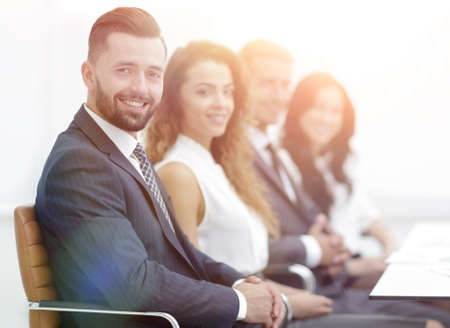 group of business people sitting at the desktopの写真素材