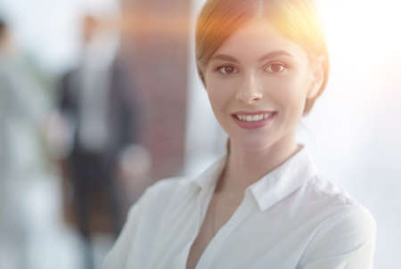 portrait of young business woman on the background of the office