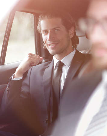 businessman sitting in his car.