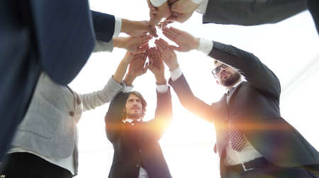 business team with hands clasped together.t