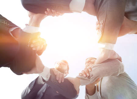 business team are taking each others handsの写真素材